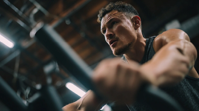Caucasian athlete doing calisthenics training in the gym