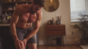 a man experiencing pain in his knees