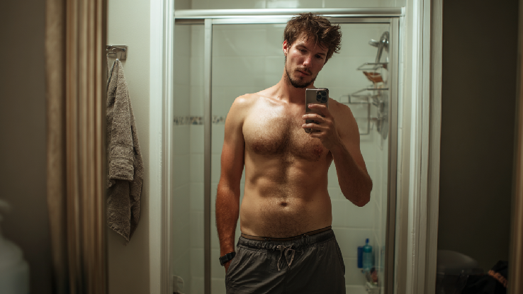 Men taking a selfie in his bathroom